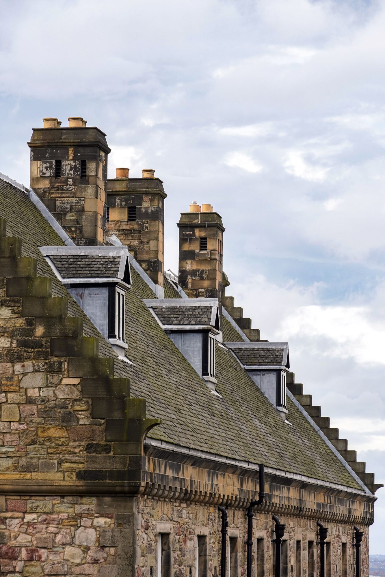 A distinctive Scottish crow stepped gable roof with dormer windows and a slate covering